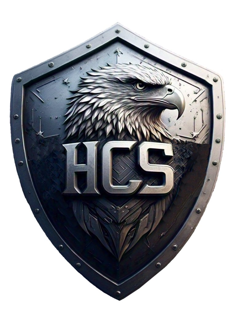 HCS Shield logo. Mettle Shield with letters HCS imprinted on body of Eagle with head popping out of shield.